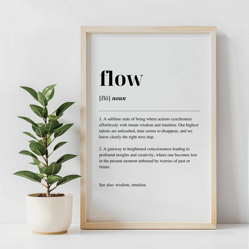 A fine art print with the word 'Flow' defined in a minimalist style, displayed in a wooden frame, with a green potted plant to the left.