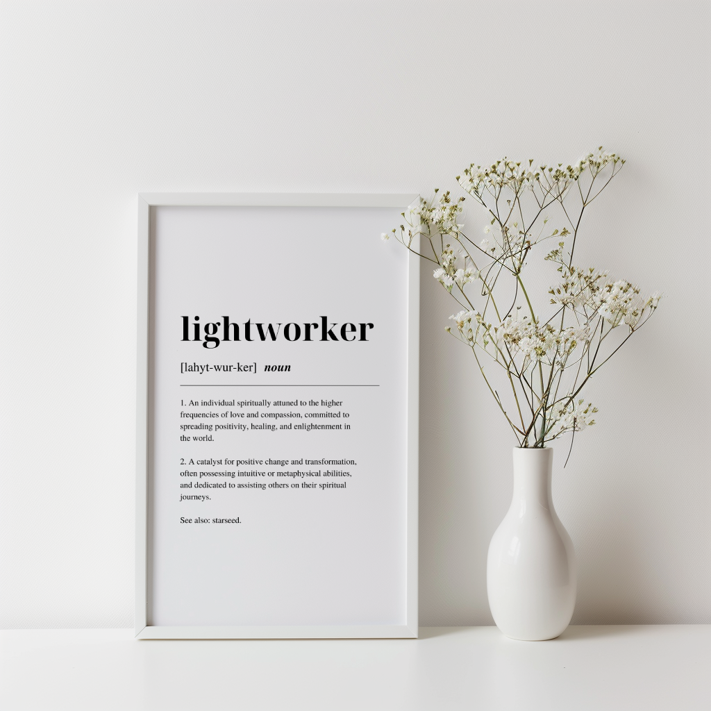 White contemporary framed poster with inspirational definition art text for the word and meaning of a Lightworker. A plant in a vase is next to the poster