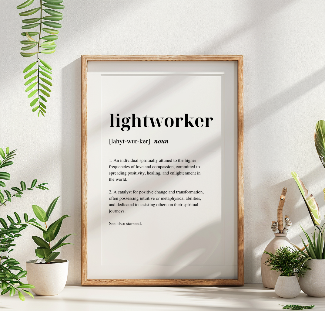 Wood framed poster with inspirational definition art text for the word and meaning of a Lightworker. Poster is surrounded with plants.